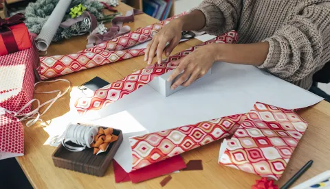 woman wrapping gifts